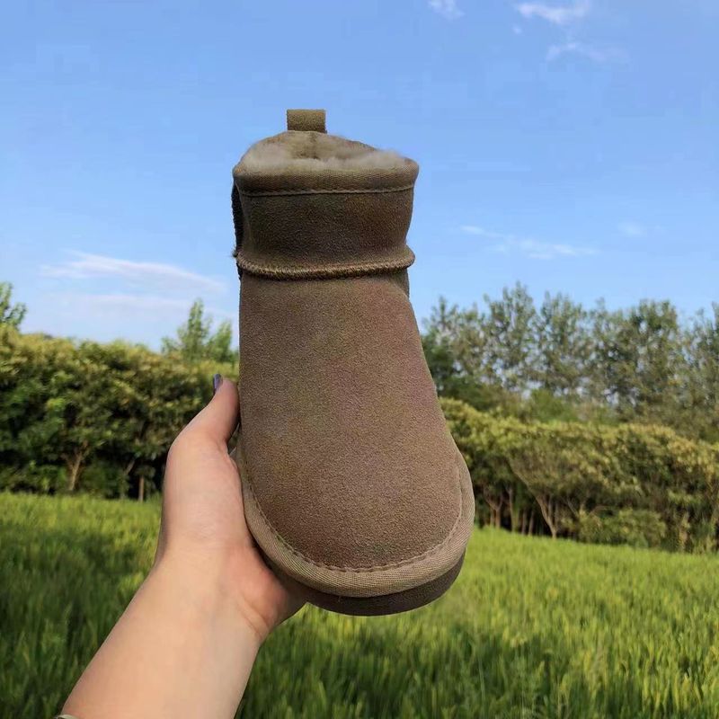 Rindslederwolle Braun Flache Absätze Lederfell Integrierte Runde Zehen Klebeschuhe Niedrig Geschnittene Mini-Schneestiefel_voghion.com