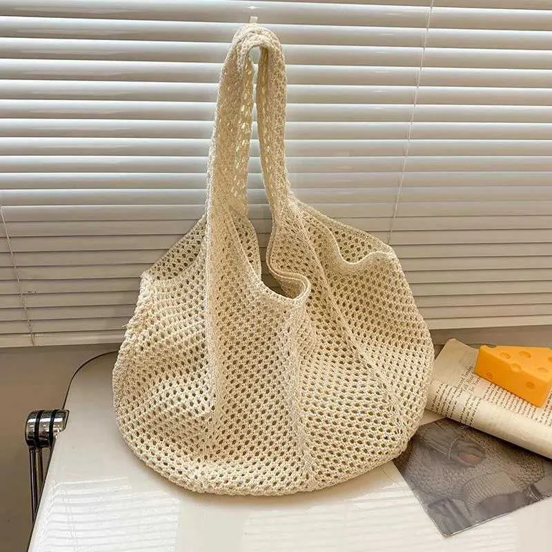 Womens crochet handbag mesh beach large capacity fashionable knitted shoulder solid color simple shopping bag Y241011_voghion.com