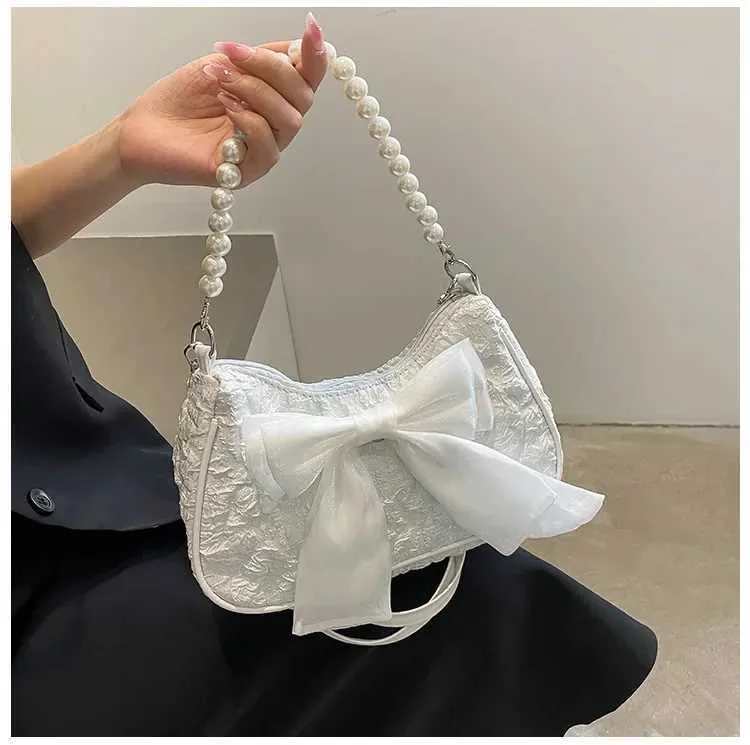Sommer Neue Frauen Perle Handtasche Modische Trendy Bowknot Plissee Weibliche Umhängetaschen Nette Vielseitige Einzelne Schulter_voghion.com
