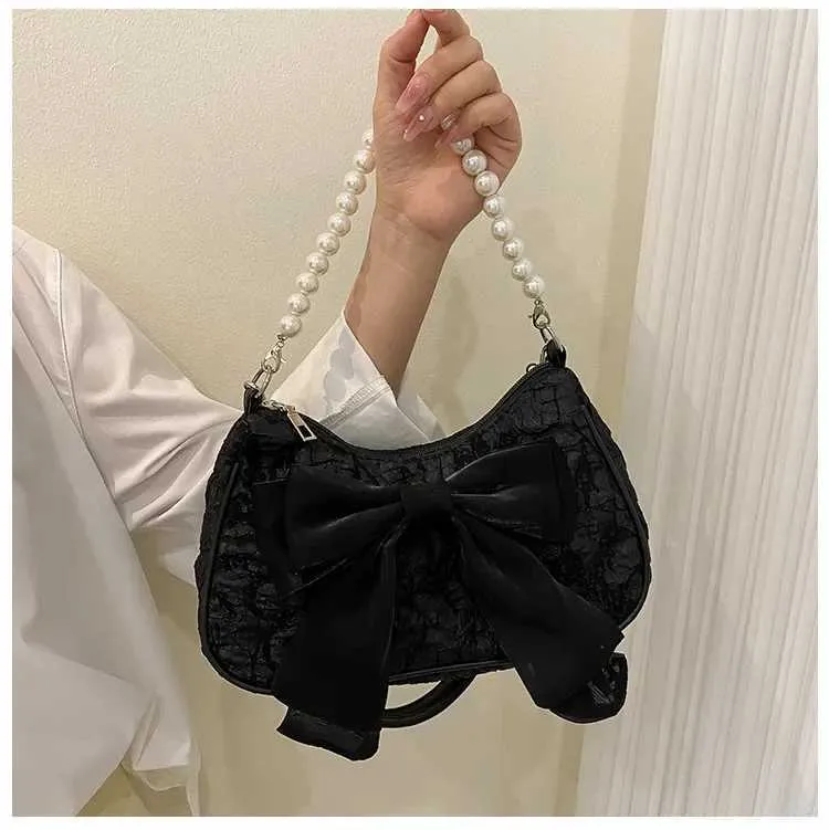Bolsa de ombro e tiracolo feminina com pérolas e laço_voghion.com