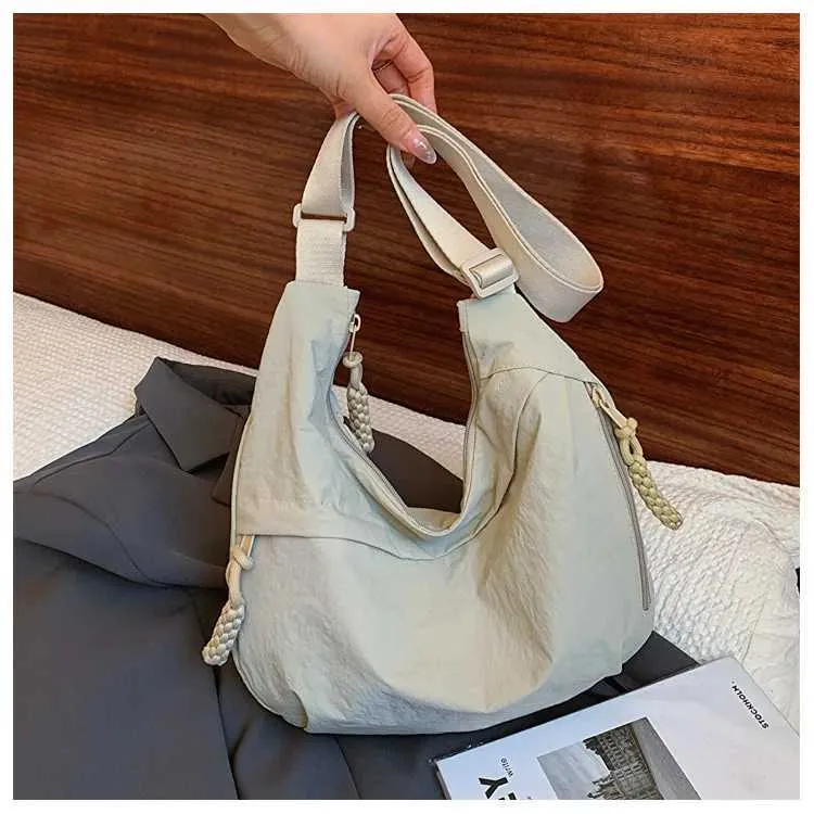 Version coréenne à la mode et minimaliste dumpg populaire cette année, nouveau sac à bandoulière de haute qualité, fourre-tout de grande capacité_voghion.com