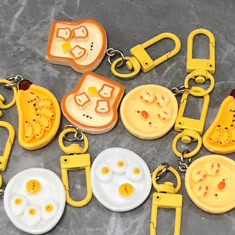 Portachiavi con simpatico cartone animato, uovo in camicia, banana e toast, creativo, per la colazione, decorazione per zaino, borse, ciondolo_voghion.com