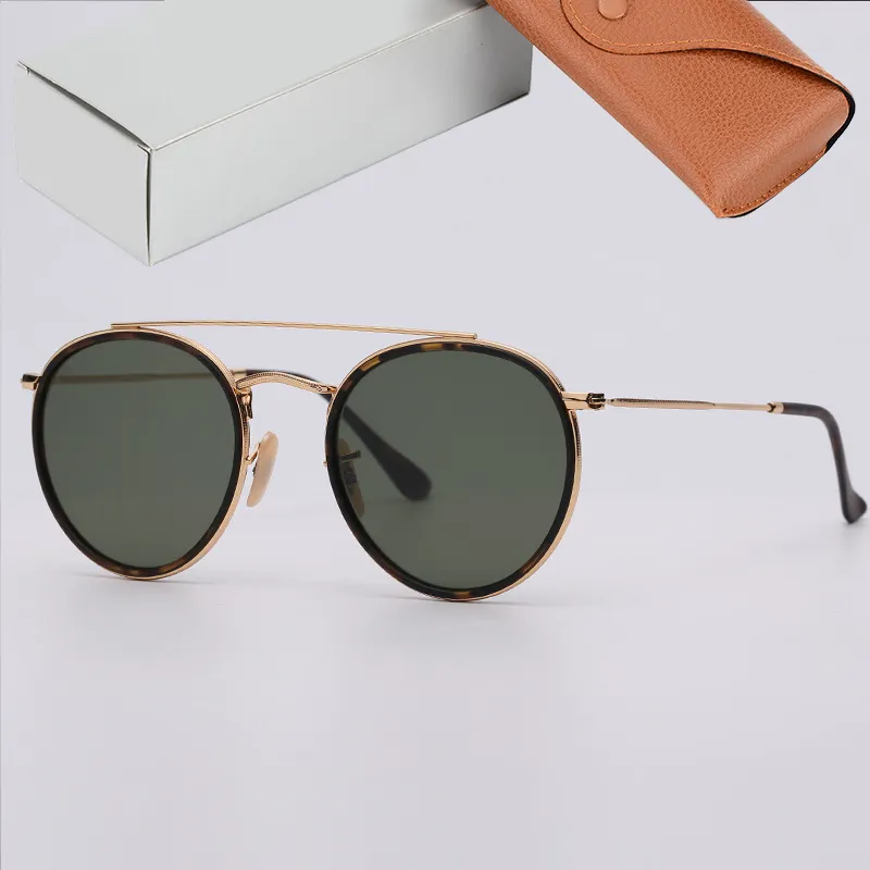 Gafas de sol redondas de metal con lentes degradadas_voghion.com