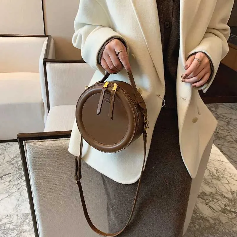 Sac à bandoulière de couleur unie pour petit sac à main rond pour femmes, sacs de créateurs de mode, sac à bandoulière en cuir, fermeture éclair pour femmes_voghion.com