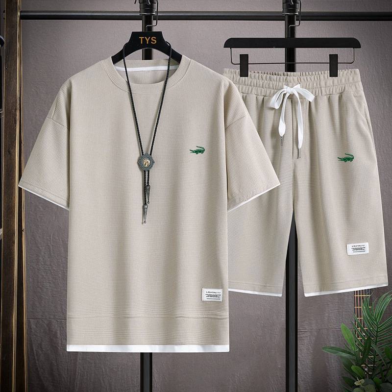 Vêtements pour hommes Style t-shirt gaufré Costume deux pièces pour hommes Couple lâche tendance grande taille Pantalon à cinq points extérieur décontracté