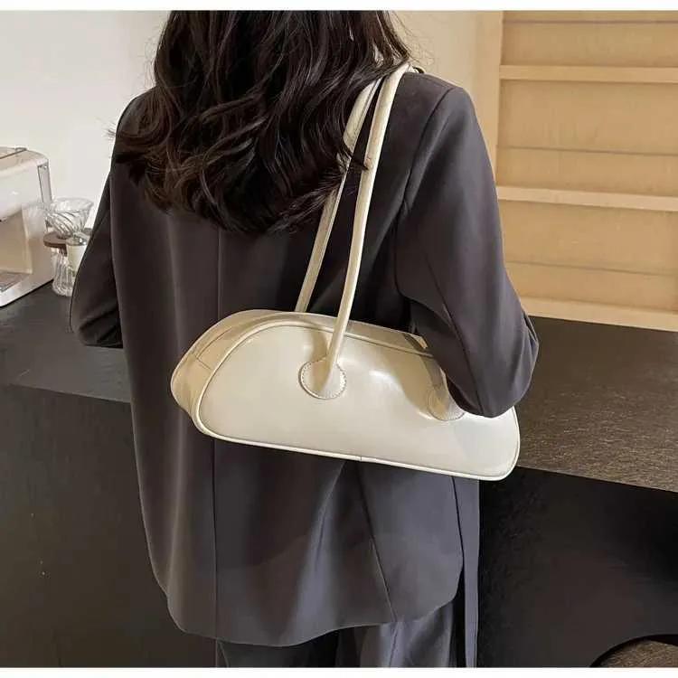 Sac à aisselles en bâton français de grande capacité, version coréenne, tendance féminine, Xiaohongshu, même style, bandoulière simple, porté à la main_voghion.com