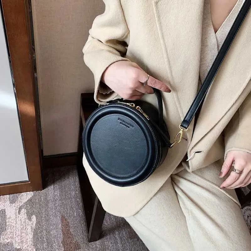 Sac à bandoulière de couleur unie pour petit sac à main rond pour femmes, sacs de créateurs de mode, sac à bandoulière en cuir, fermeture éclair pour femmes_voghion.com