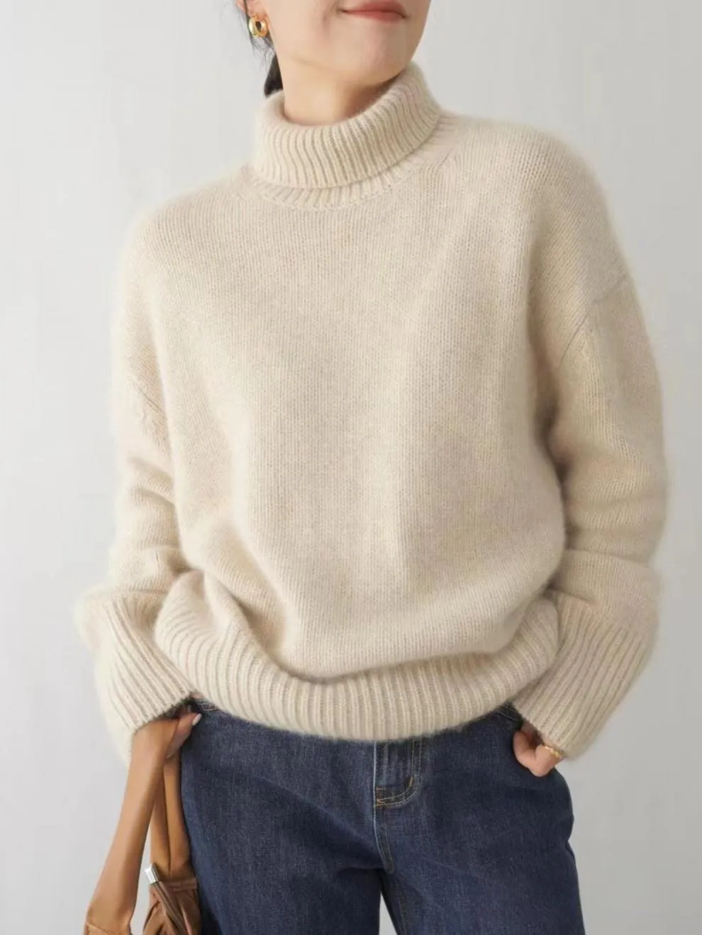 Pulls pour femmes Pull tricoté en cachemire pour femmes Élégant col haut Col roulé Lâche Épaissir Chaud Couleur unie_voghion.com
