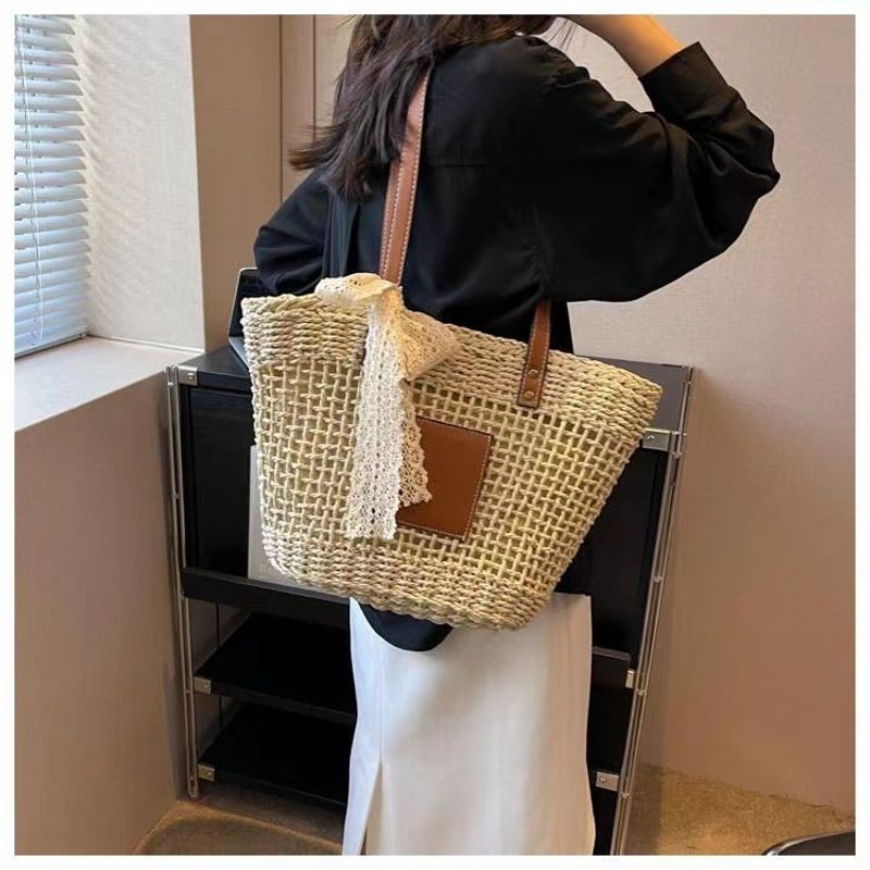 hollow shoulder new simple straw woven holiday style beach versatile women's bag_voghion.com