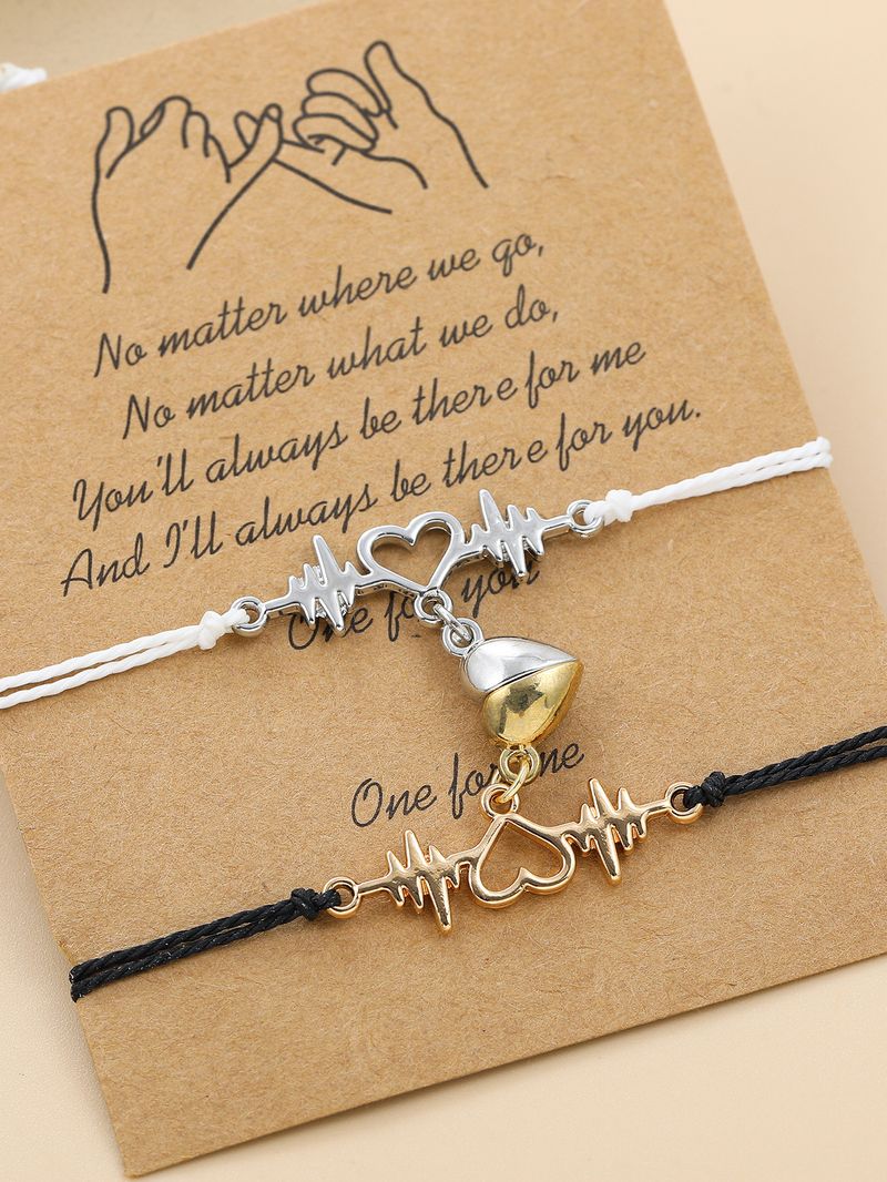 Coppia di braccialetti magnetici a forma di cuore intrecciati a mano in bianco e nero_voghion.com