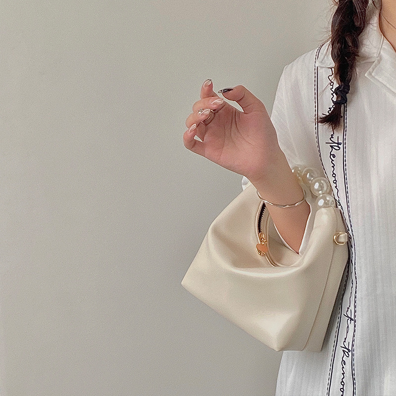 Petit sac à bandoulière de niche pour femmes avec un design de perles fraîches 2024 avec un sens de la chaîne et un sac à boulettes à main_voghion.com