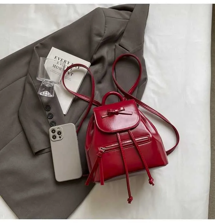 Mochila feminina sólida com aba e laços, mini bolsas de ombro, versátil, feminina, grande capacidade, bolsas de couro, casual, estudante_voghion.com