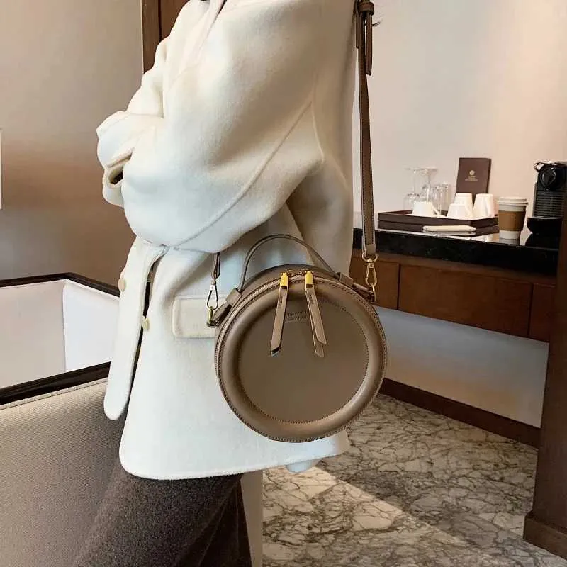 Sac à bandoulière de couleur unie pour petit sac à main rond pour femmes, sacs de créateurs de mode, sac à bandoulière en cuir, fermeture éclair pour femmes_voghion.com