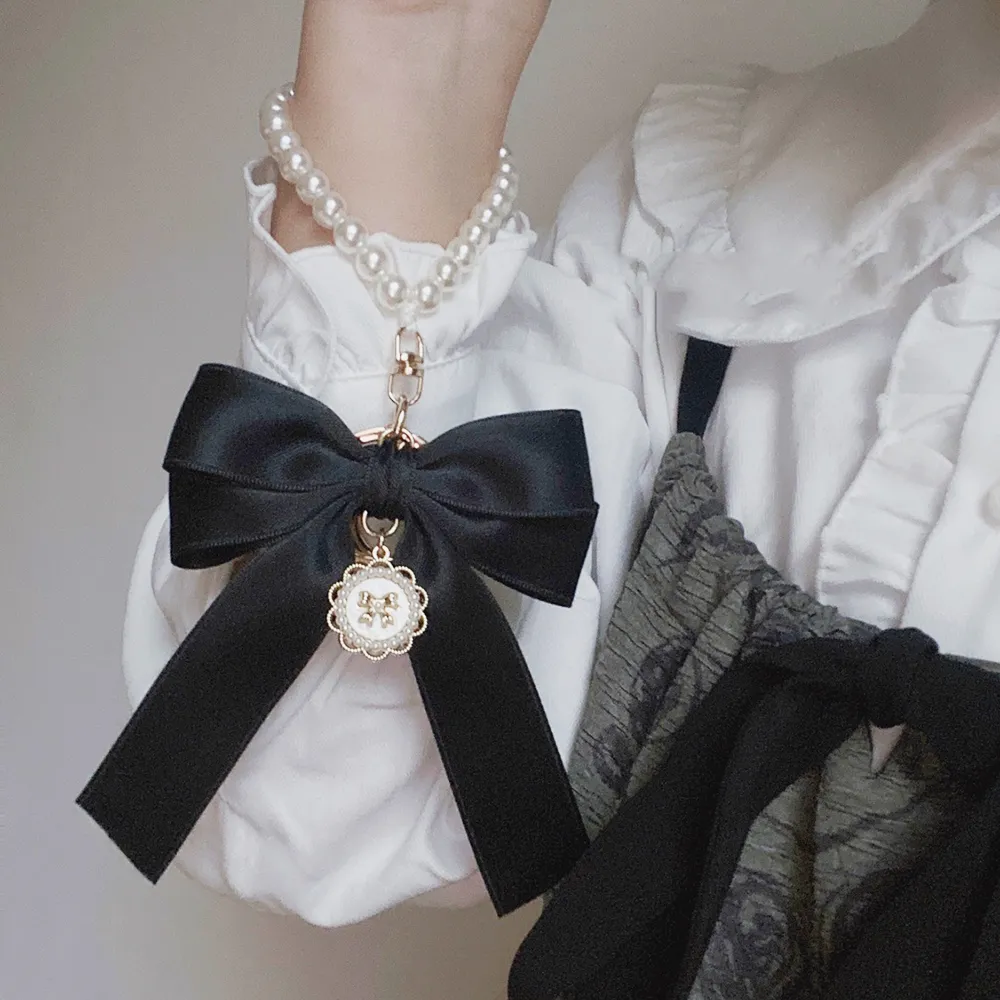 Y2K Band Bowknot Perlen Anhänger Charm Schlüsselanhänger Elegantes Perlenarmband Schlüsselanhänger Süße Kette Handy Schlüsseltasche Behänge_voghion.com