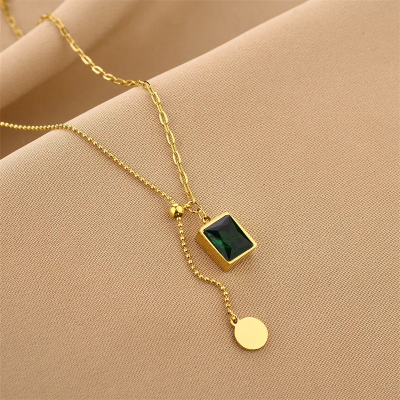 Collier pendentif zircon vert croix chaîne acier titane femme_voghion.com