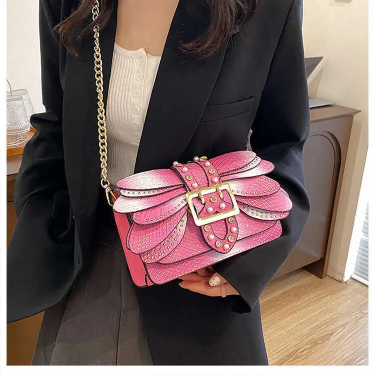 Borsa donna a tracolla con catena e motivo a serpente_voghion.com