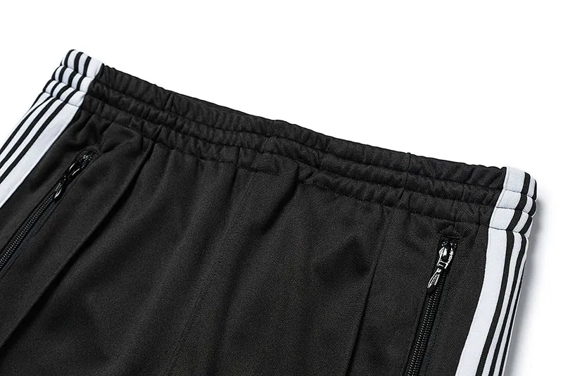 Mäns Needles-spår Fritidsbyxor Streetwear AWGE Träningsbyxor Kvinnor Herr Randig Dragkedja Byxa Butterfly Broderi Joggers Needles_voghion.com