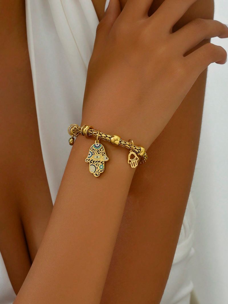 Nerūsējošā tērauda piekariņu aproce sievietēm zelta krāsas Hamsa rokas formas aproce_voghion.com