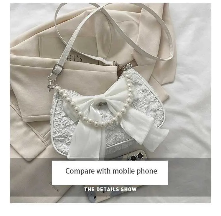 Bolsa de ombro e tiracolo feminina com pérolas e laço_voghion.com