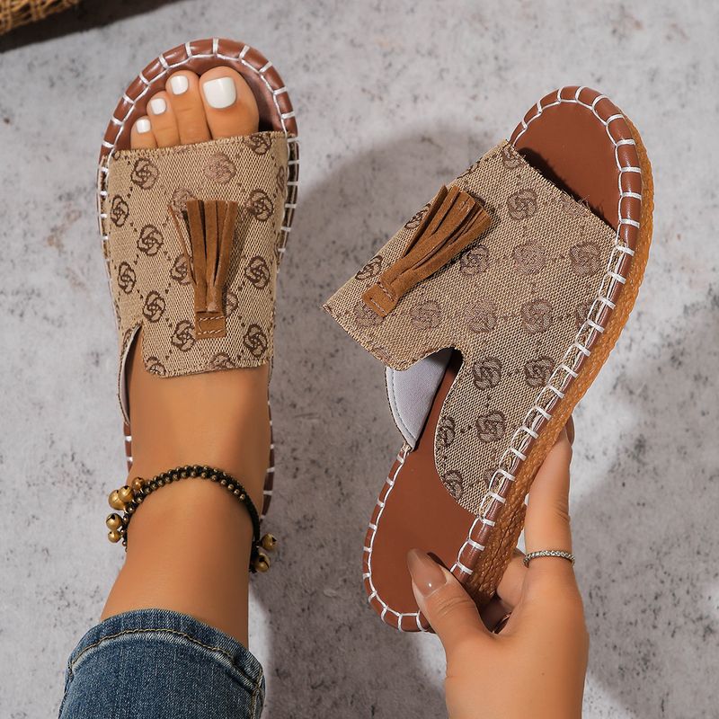 Pantofole da donna con punta aperta e nappe piatte alla moda_voghion.com
