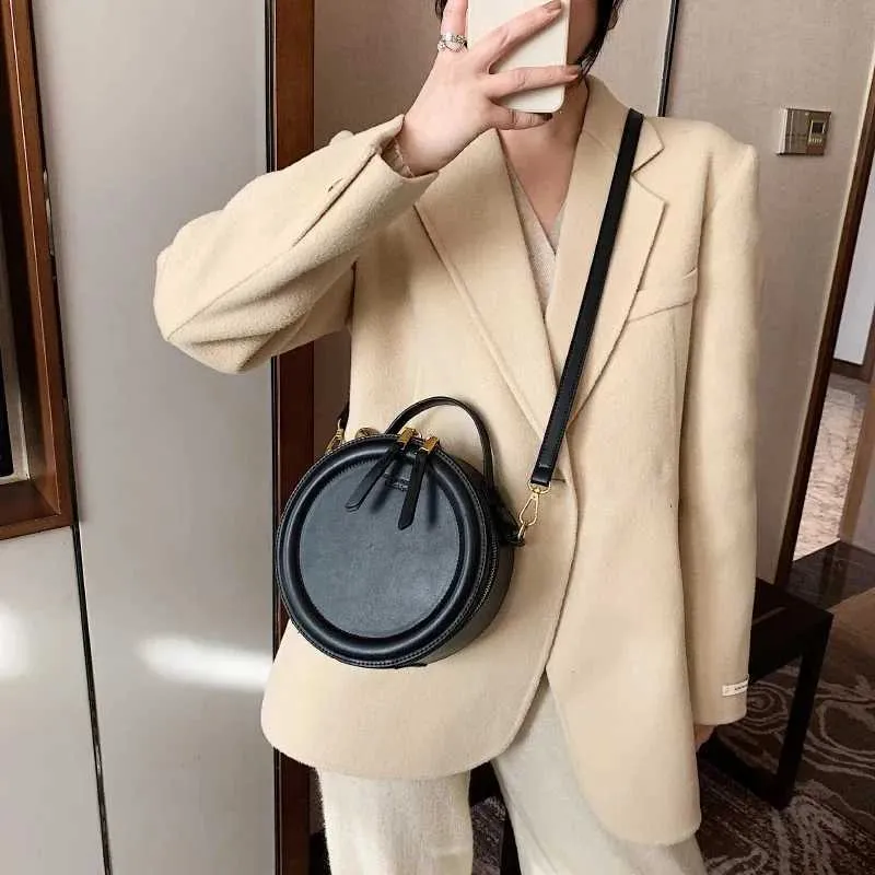 Sac à bandoulière de couleur unie pour petit sac à main rond pour femmes, sacs de créateurs de mode, sac à bandoulière en cuir, fermeture éclair pour femmes_voghion.com