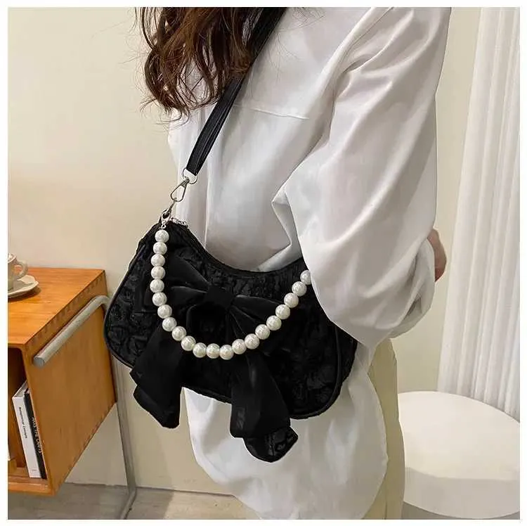 Bolsa de ombro e tiracolo feminina com pérolas e laço_voghion.com
