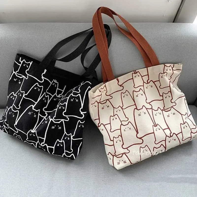 Canvas 2023 fashionable cute cat handbag messenger with zipper designer womens cartoon shoulder shopping bag Y241011_voghion.com