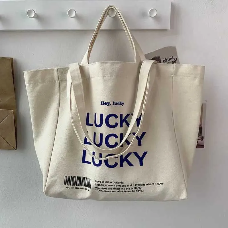 Large capacity retro letter printed canvas handbag with foldable design - perfect for casual shopping and daily use_voghion.com