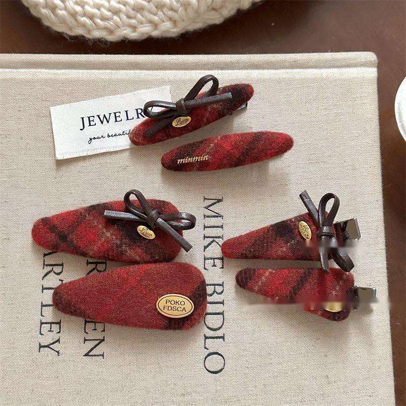 Fermaglio a fiocco rosso a quadri per accessori capelli invernali_voghion.com