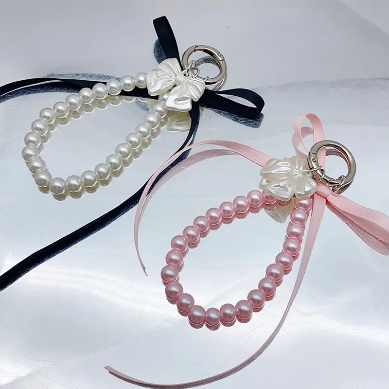 Portachiavi con fiocco in nastro, perline e perle, bianco latte, con nodo a farfalla, ciondolo per borsa da bambina, ciondoli per zaino, decorazioni e regali._voghion.com