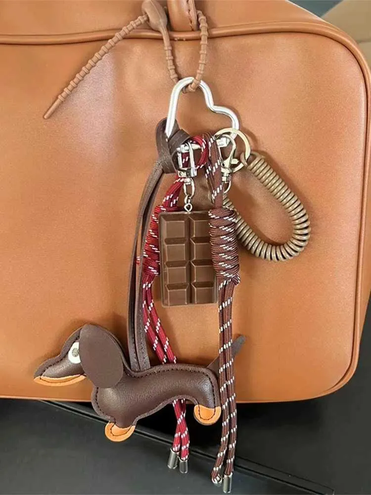 Breloque de poche en forme de saucisse tissée Pendentif composite polyvalent Accessoire de sac pour téléphone portable Corde de suspension décorative Y241121_voghion.com