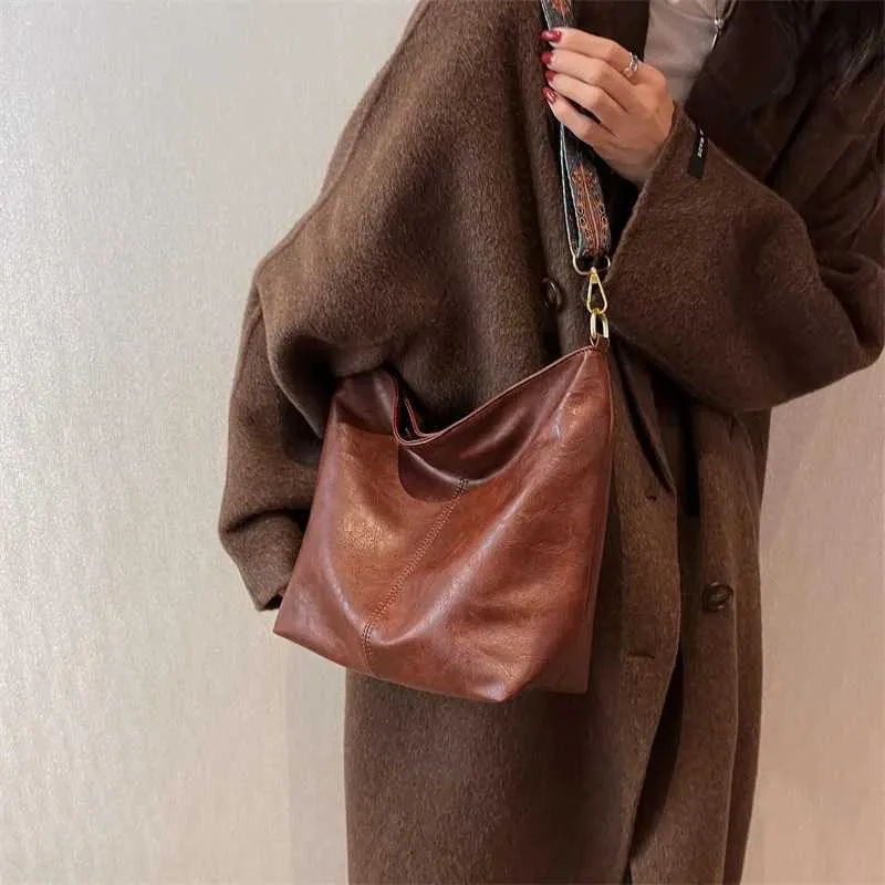 Borsa a tracolla vintage tinta unita in pelle PU da donna alla moda, con tracolla larga e semplice, a secchiello, a tracolla Ba241216_voghion.com