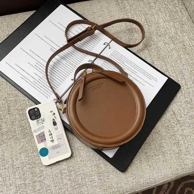 Sac à bandoulière de couleur unie pour petit sac à main rond pour femmes, sacs de créateurs de mode, sac à bandoulière en cuir, fermeture éclair pour femmes_voghion.com