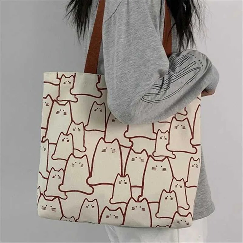 Canvas 2023 fashionable cute cat handbag messenger with zipper designer womens cartoon shoulder shopping bag Y241011_voghion.com