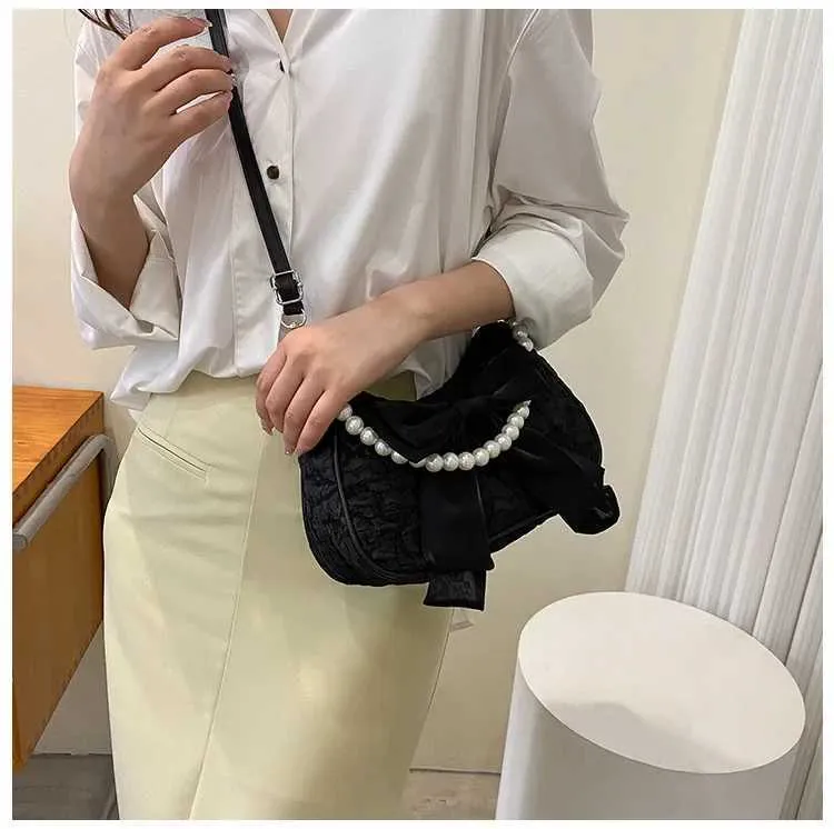 Bolsa de ombro e tiracolo feminina com pérolas e laço_voghion.com