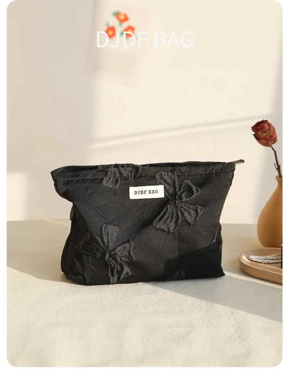 Pochette trucco nera con fiocco grande beauty case elegante_voghion.com