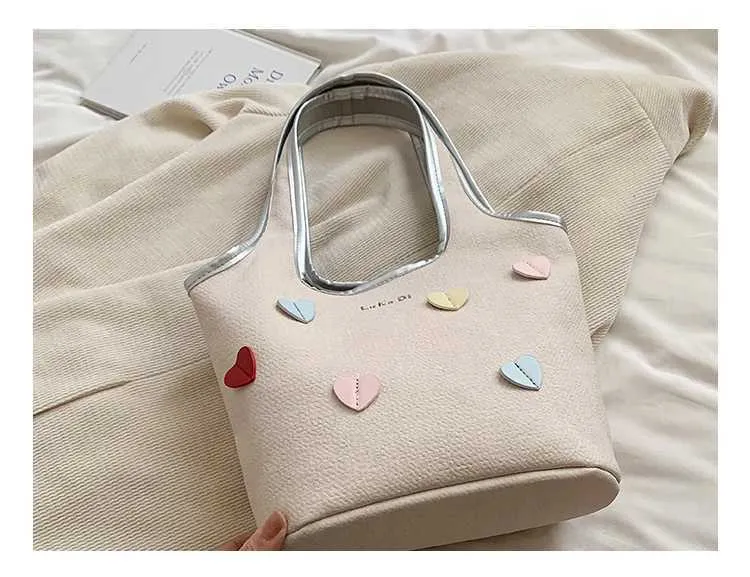 Borsa a secchiello in denim da donna con cuori grande a spalla_voghion.com
