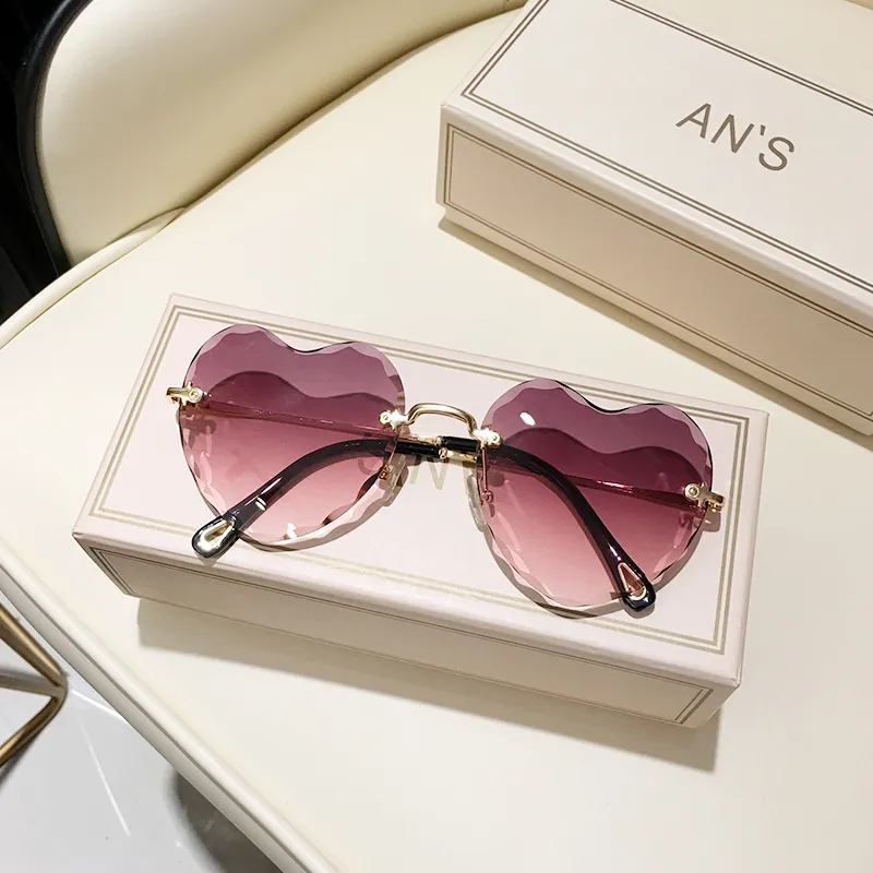 Hartvormige zonnebril dames randloze cat eye designer bril_voghion.com
