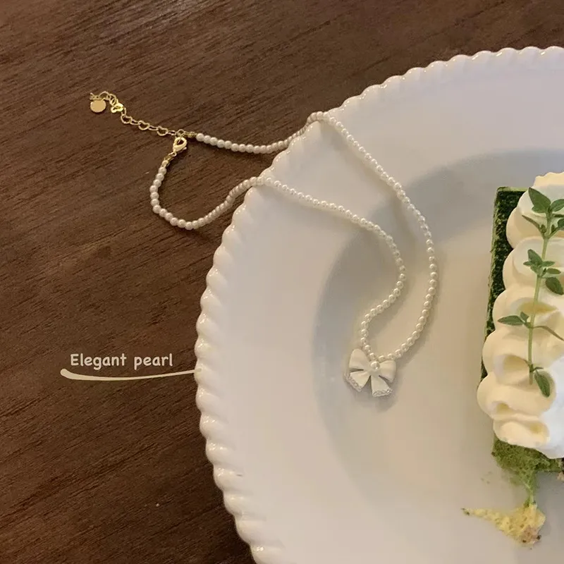 Collier avec pendentif en forme de nœud en perles de haute qualité pour femme, joli bijou, accessoire, cadeau de mariage_voghion.com