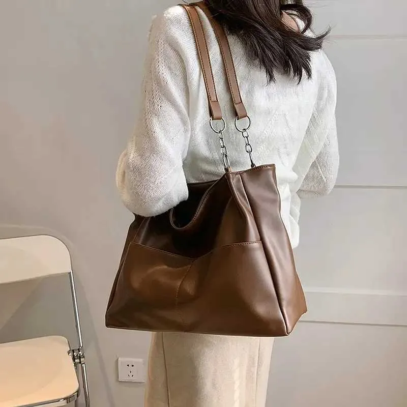 Sacs à bandoulière pour femmes Vintage Couleur unie Simple Grande capacité Grand cuir PU Les derniers sacs à main de voyage_voghion.com