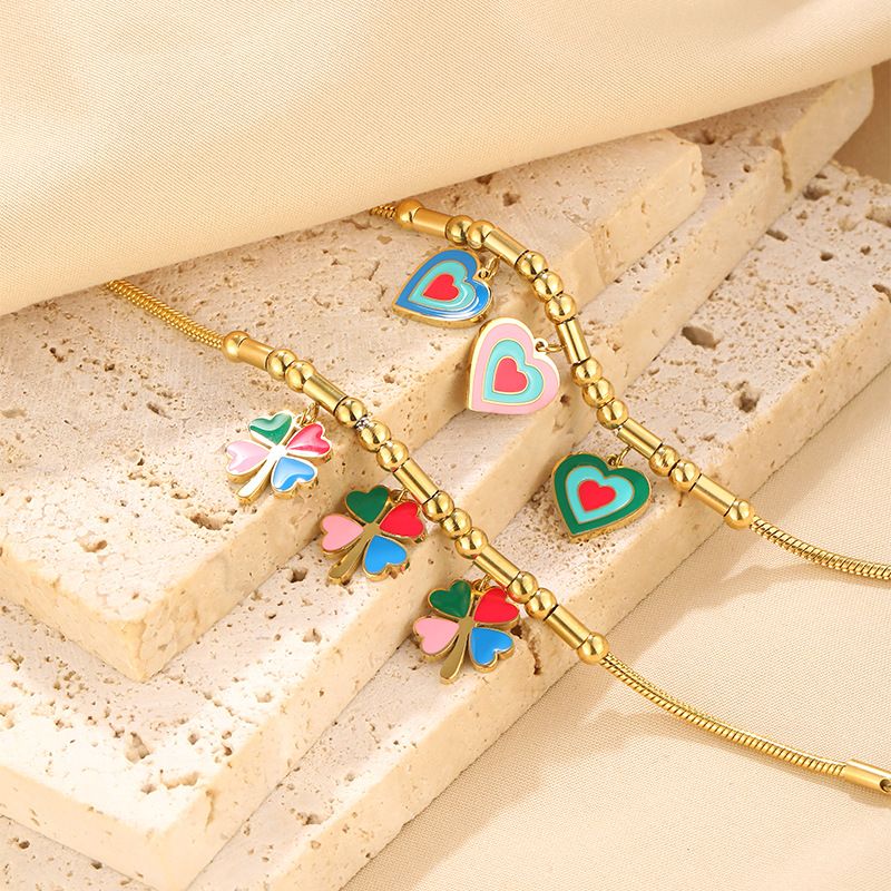 Bracciale personalizzato in acciaio inossidabile placcato oro con ciondolo a forma di quadrifoglio Dripping Love_voghion.com