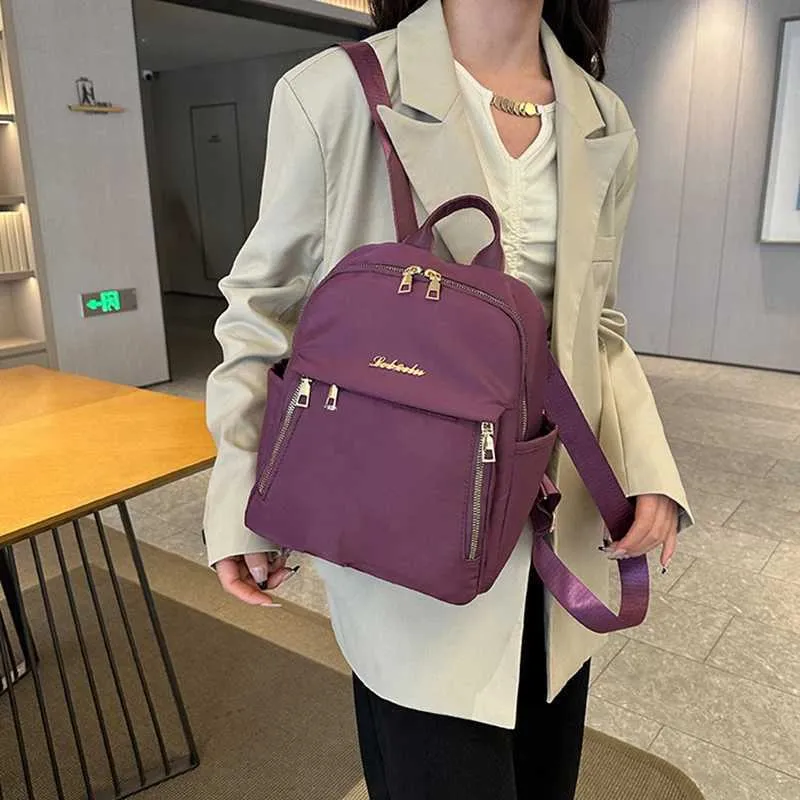 Sac à dos à la mode en nylon imperméable à haute capacité avec fermeture éclair solide 2024 hot selg Sac polyvalent pour femme Mujer Mochila_voghion.com