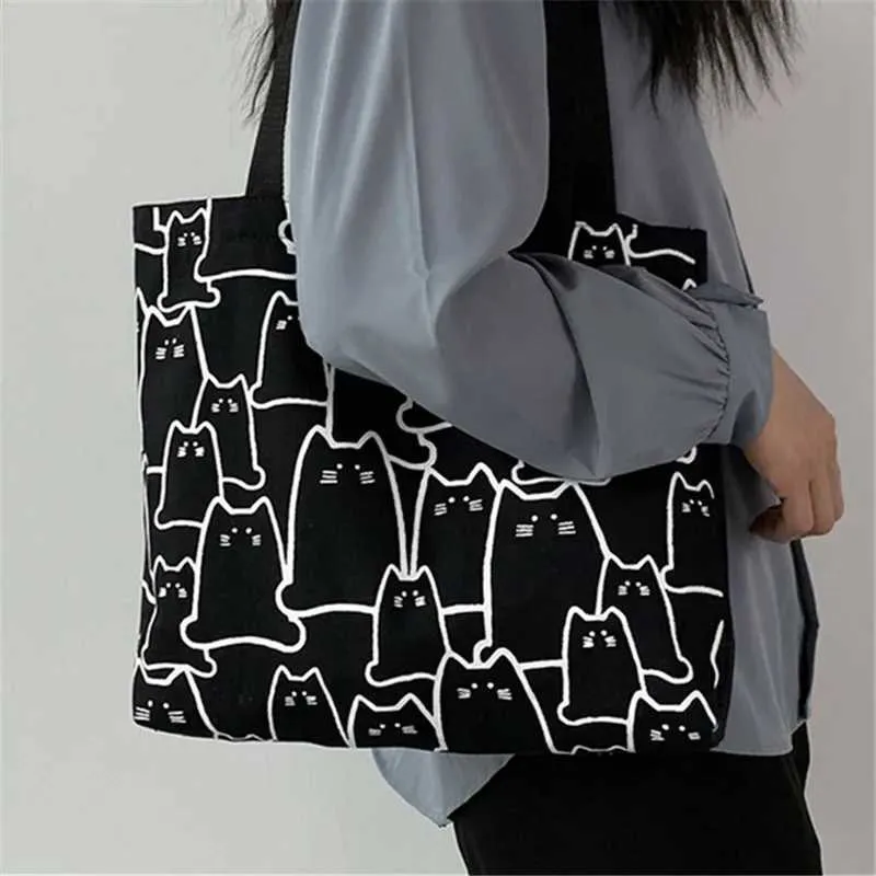 Canvas 2023 fashionable cute cat handbag messenger with zipper designer womens cartoon shoulder shopping bag Y241011_voghion.com