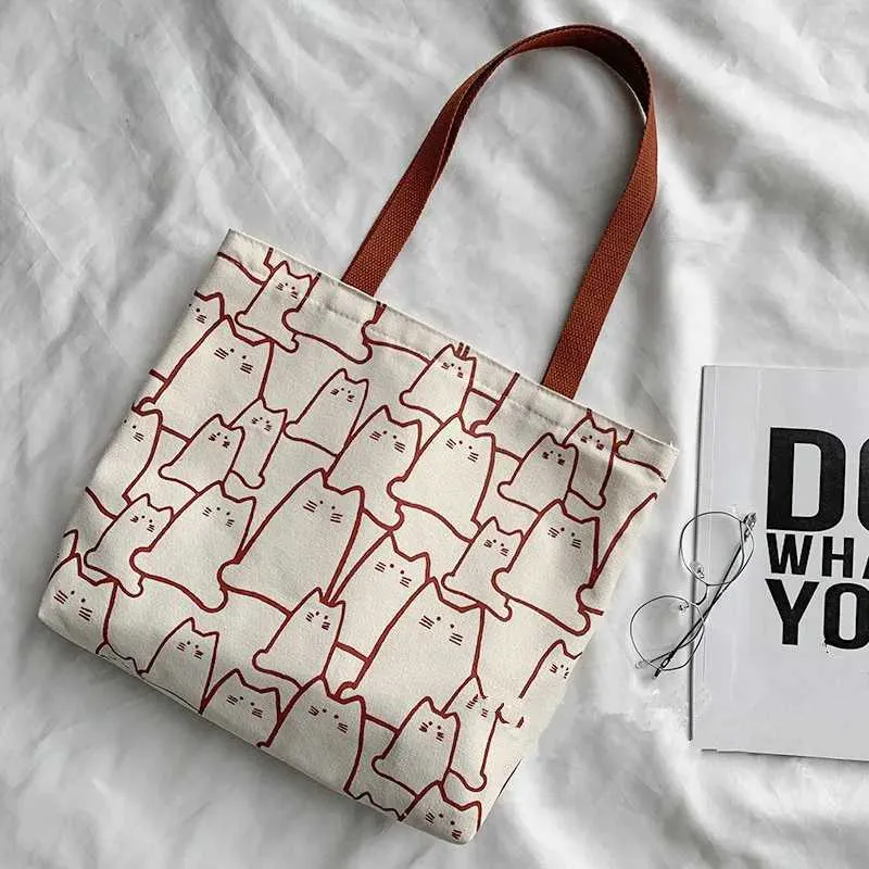 Canvas 2023 fashionable cute cat handbag messenger with zipper designer womens cartoon shoulder shopping bag Y241011_voghion.com
