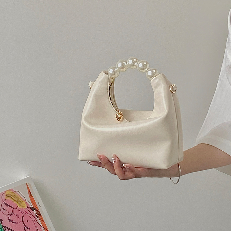 Petit sac à bandoulière de niche pour femmes avec un design de perles fraîches 2024 avec un sens de la chaîne et un sac à boulettes à main_voghion.com
