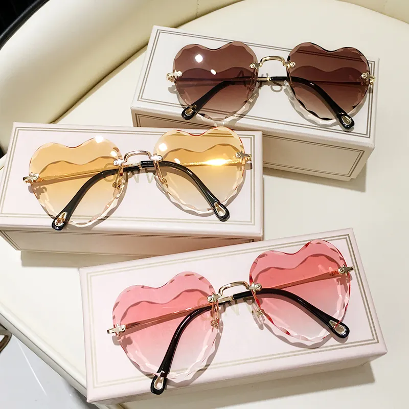 Hartvormige zonnebril dames randloze cat eye designer bril_voghion.com