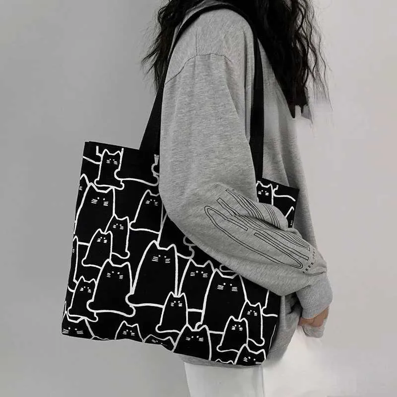 Canvas 2023 fashionable cute cat handbag messenger with zipper designer womens cartoon shoulder shopping bag Y241011_voghion.com