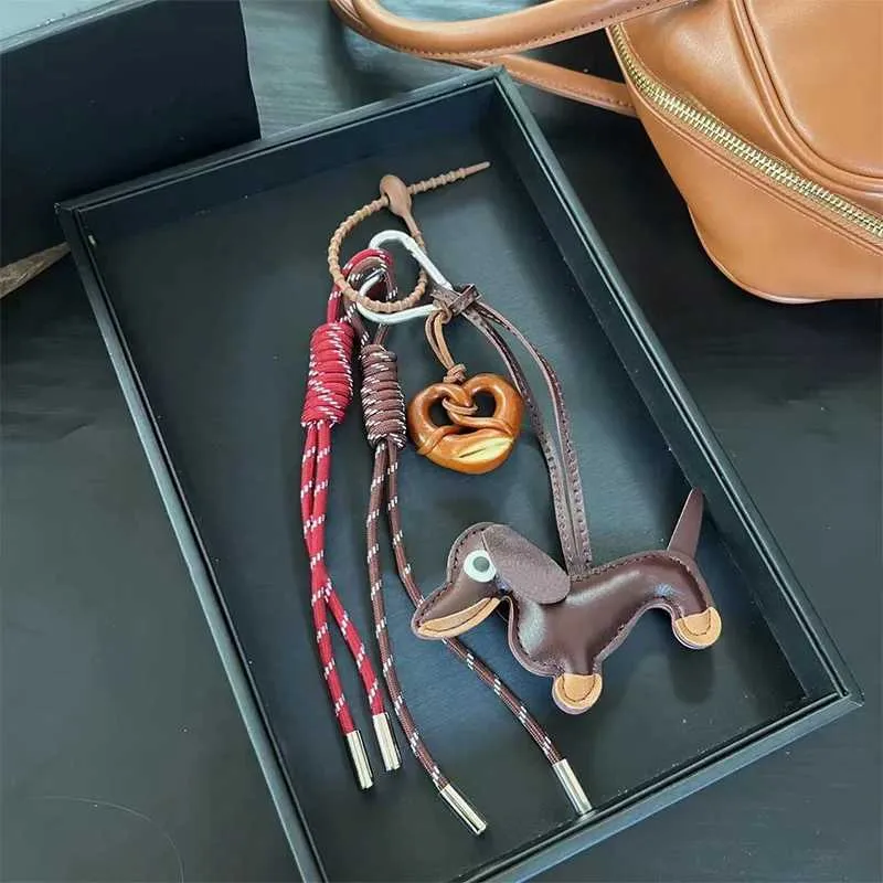 Breloque de poche en forme de saucisse tissée Pendentif composite polyvalent Accessoire de sac pour téléphone portable Corde de suspension décorative Y241121_voghion.com