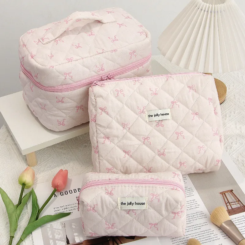 Designer 2025 New Pink Ribbon Bow Makeup Korean Style Sweet Girl Student Large Capacity Toilet Bag Pillow Shaped Quilted_voghion.com