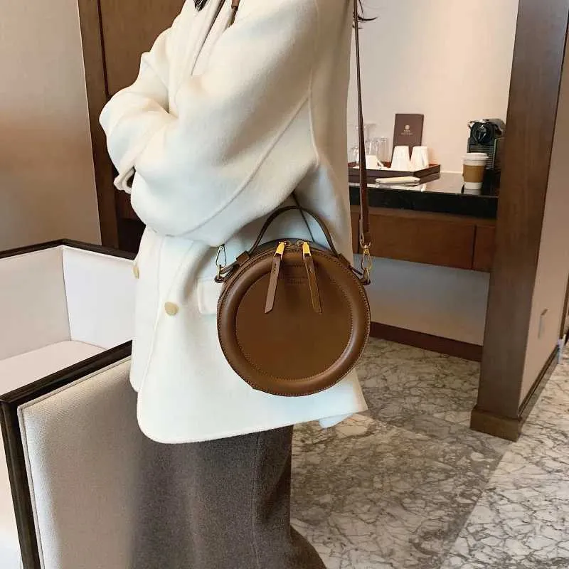 Sac à bandoulière de couleur unie pour petit sac à main rond pour femmes, sacs de créateurs de mode, sac à bandoulière en cuir, fermeture éclair pour femmes_voghion.com